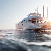 Catamaran motor yacht on the ocean | SUPERPOBYT World